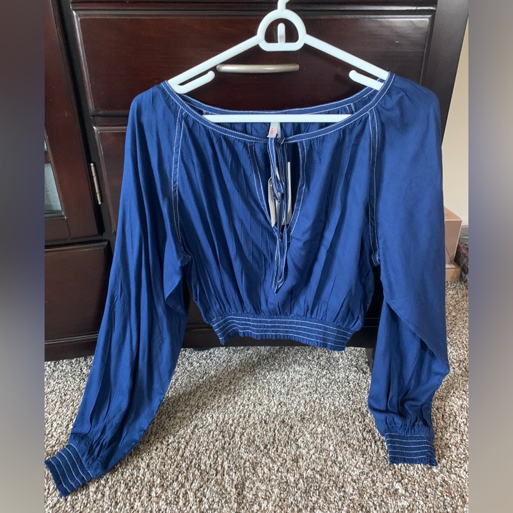 Never worn, discovery top, blue long sleeve